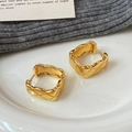 Elegant gold square earrings with diamond quilted pattern on white ceramic tray - Gold