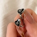 Detail of heart-shaped earrings with black enamel and silver bowknot design - Silver Black Heart (Bow)