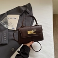 Deep brown pebble leather handbag with gold twist lock and crossbody strap - Coffee