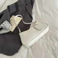 Minimalist white baguette underarm bag with a large silver circular buckle detail - White