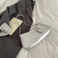 Metallic silver underarm tote bag with round buckle on a minimalist white backdrop - Silver