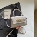 White lychee pattern leather handbag with gold clasp and adjustable crossbody strap - Off-white
