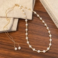 Elegant pearl and gold bead necklace with adjustable slide clasp on wood background - Gold White Pearl Style
