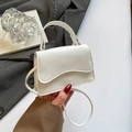 Chic white square crossbody bag featuring a wavy flap design and smooth leather texture - White