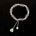 Elegante bracciale di cristallo trasparente con ciondoli a fiore e perla su sfondo nero - Stile Perle Trasparenti Mughetto (D-235)