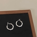 Polished silver twisted rope hoop earrings displayed on a dark wooden jewelry tray - Thick Twisted Texture Style (A-1324)