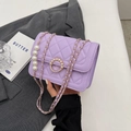 Mini purple quilted crossbody bag featuring elegant pearl chain and decorative pearl clasp - Small / Purple