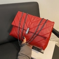 Chic red quilted crossbody bag with stylish V-stitch pattern and dark metal chain strap - Red