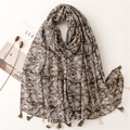 Retro paisley cotton linen scarf with tassels displayed on a minimalist white table - Dark Coffee