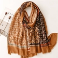 Elegant gold-tone cotton linen scarf with ethnic leaf patterns and fringe edges - Brown