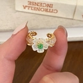 Detail of handmade flower ring featuring white petals, green beads and gold wire wrapping - Gold Crystal Flower Ring