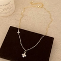 Close-up of golden necklace with zircon flower pendants and adjustable lobster clasp - Gold Necklace