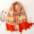 Geometric satin scarf with orange tassels and minimalist Nordic style flat lay aesthetic - 180cm x 90cm / Orange