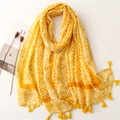 Detail of yellow geometric print scarf with fringed edges and soft cotton texture - Yellow