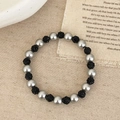 Close-up of a silver pearl and black crystal disco ball beaded stretch bracelet - Black Pearl Bracelet