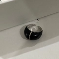 Detailed close-up of a French retro silver ring with black enamel oil drip design - Black