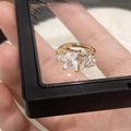 Macro detail of luxury gold-plated ring featuring large emerald cut white gemstone - Emerald Cut Large Zirconia Dual-Use Ring Ear Cuff (A-899)