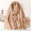 Detail of beige scarf featuring golden reindeer prints and soft linen texture - 180*90CM / Khaki