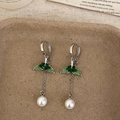 Detail of green butterfly wing earrings with white pearl drop on textured tray - Long Pearl Fishtail Drop Style (A-1196)