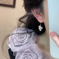 Detail of cluster pearl earrings with white round pearls and silver studs on a model - Pink Purple Pearl Earrings