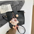 Chic black woven bucket bag with vintage wooden button and cute plush charm detail - Black With Pendant