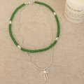 Double-layered necklace with emerald green beads, silver chain, and bow pendant - Green Glass Bead Style