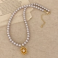 Elegante collana di perle grigie con ciondolo a stella dorata su lino rustico - Collana Oro (Perla Grigio Viola)