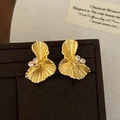 Elegant gold fan-shaped stud earrings with zircon stones on a vintage brown velvet display - Gold (A-1512)