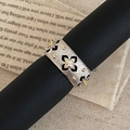 Macro detail of retro wide band ring with silver finish and black enamel floral patterns - Wide Version / Silver Wide Band Ring