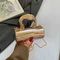 Elegant gold acrylic cylinder handbag with shiny metallic finish and thick curved handle - Light gold