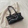 Chic black oil wax leather shoulder bag with decorative metallic eyelet buckle details - Black