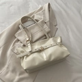 Chic cream oil wax leather shoulder bag with gold hardware and buckle detail - White