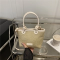 Woven straw bucket bag with white knotted leather handles and adjustable shoulder strap - White