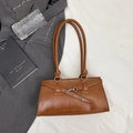 Vintage brown leather shoulder bag with decorative straps and silver metal hardware - Brown