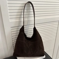 Deep brown matte suede hobo tote bag for women shown against white background - Brown