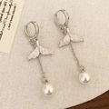 Elegant silver fishtail earrings with pink crystals and pearls on white linen - Pink Crystal Fish Tail Pearl Drop Earrings (A-1196)
