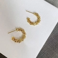 Detailed view of C-shaped gold hoop earrings featuring irregular crushed metal texture - 2cm/4.60g / Gold (2cm)