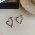 Elegant silver heart earrings with a minimalist hollow design on a white ceramic tray - Heart Hoop Earrings (A-61)