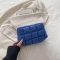Quilted navy blue puffer toiletry bag with puffer fabric and stylish zipper closure - Blue