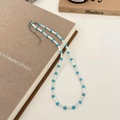 Detailed shot of handmade necklace with blue beads and white oblong freshwater pearls - Blue Turquoise and Shell Bamboo Joint Beaded Necklace