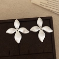 Macro detail of matte silver flower earrings with pleated texture in a premium jewelry box - Silver Brushed Petal Stud Earrings (A-1510)
