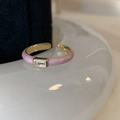 Detail of adjustable gold ring with purple enamel and rectangular zircon crystal inlay - Pink