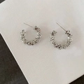 Detail of silver hoop earrings featuring unique layered irregular metallic textures - 2cm/4.60g / Silver (2cm)