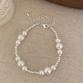 Elegant silver bead and white pearl bracelet with adjustable lobster clasp on beige fabric - White Pearl Bracelet (B-46)