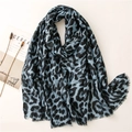 Blue and black leopard print scarf with fringe details laid on a minimalist background - Blue Leopard Print Style (SL2110-016 Blue)