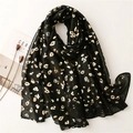 Lightweight black bali yarn scarf with golden leopard print and frayed edges - Black
