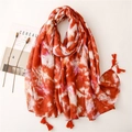 Artistic tie-dye cotton-linen feel scarf in orange and white with tassel edges - Rust red