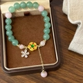 Bracciale cinese con perline di pietra naturale verde e decorazioni floreali dorate - Pietra Verde Rosa Fiore in Metallo (D-190)