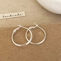 Macro detail of silver hoop earrings with stardust texture on brown paper background - Silver Color 2.5cm