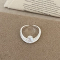 Detailed top view of a wide textured silver ring with a round brilliant zircon stone - Silver Zircon Inlaid Ring / Silver